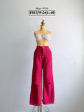 Bright pink wide-leg pants with ripped detailing at both knees